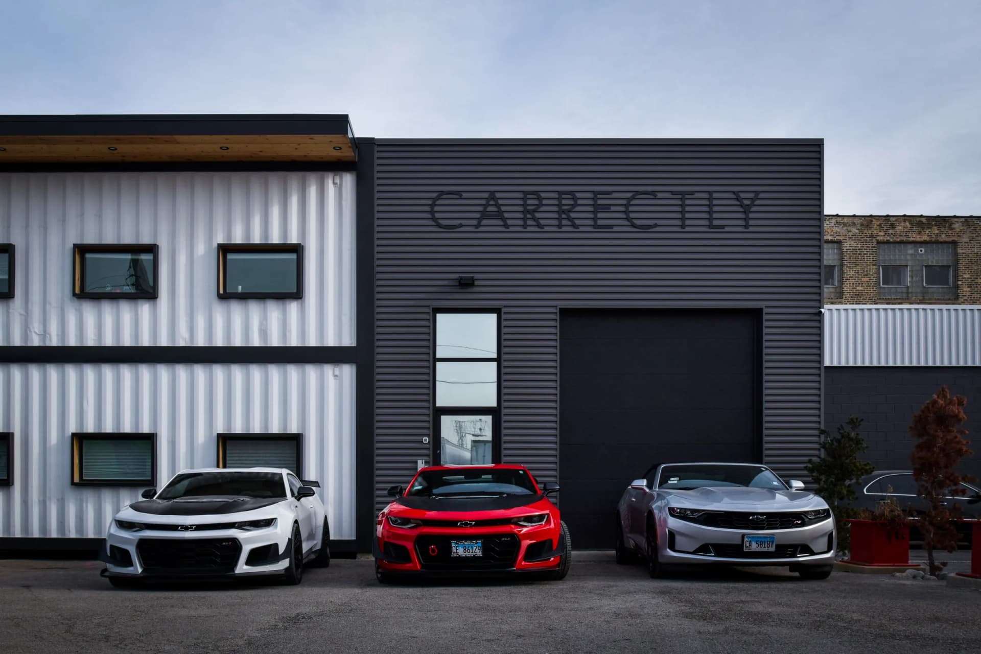Chevrolet Camaros parked outside the Carrectly Auto Care facility in Chicago