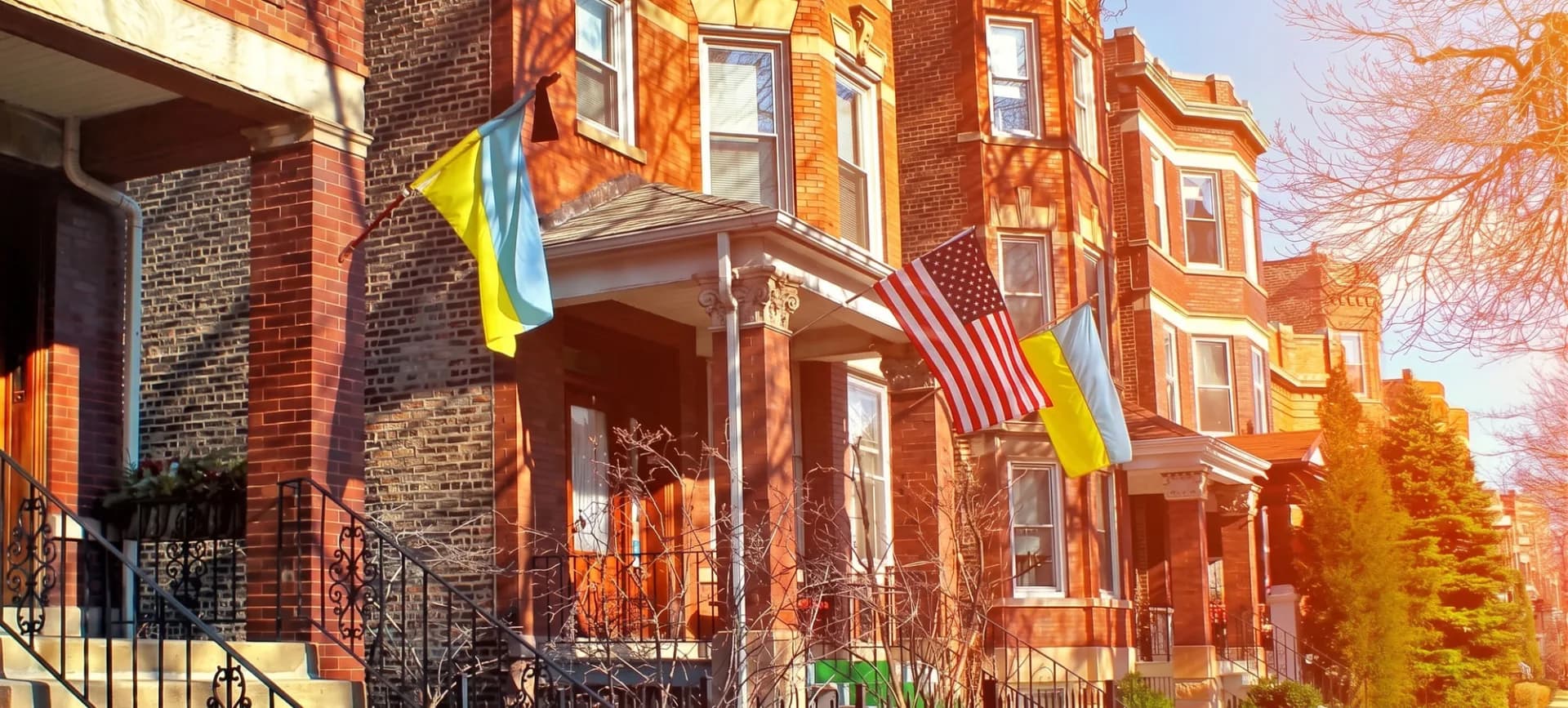 A row of Chicago Ukrainian Village homes flying Ukrainian and American flags
