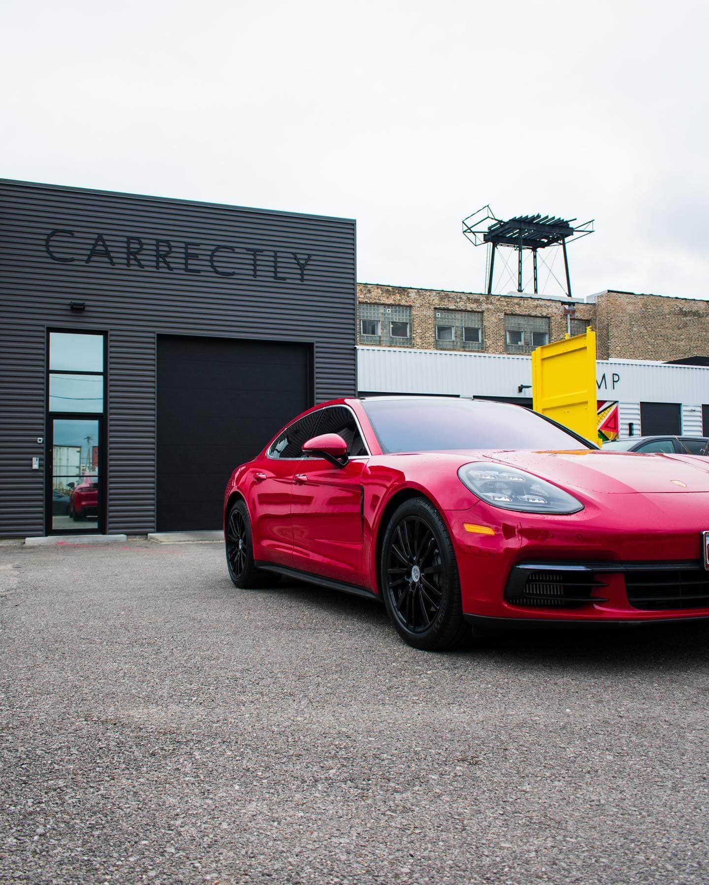 Red Porsche parked, enhanced by a thorough exterior detail