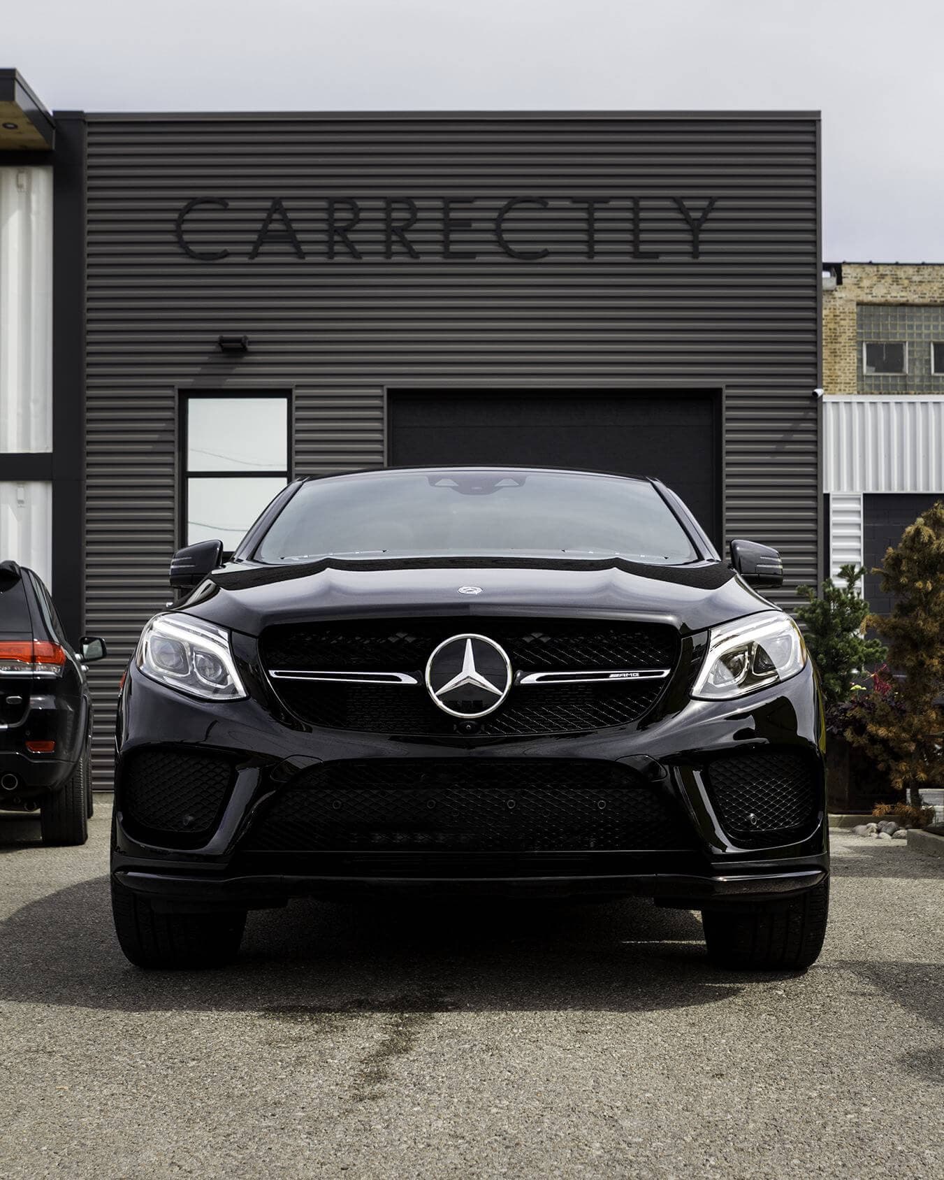 Black Mercedes-Benz front, polished with exterior detail.