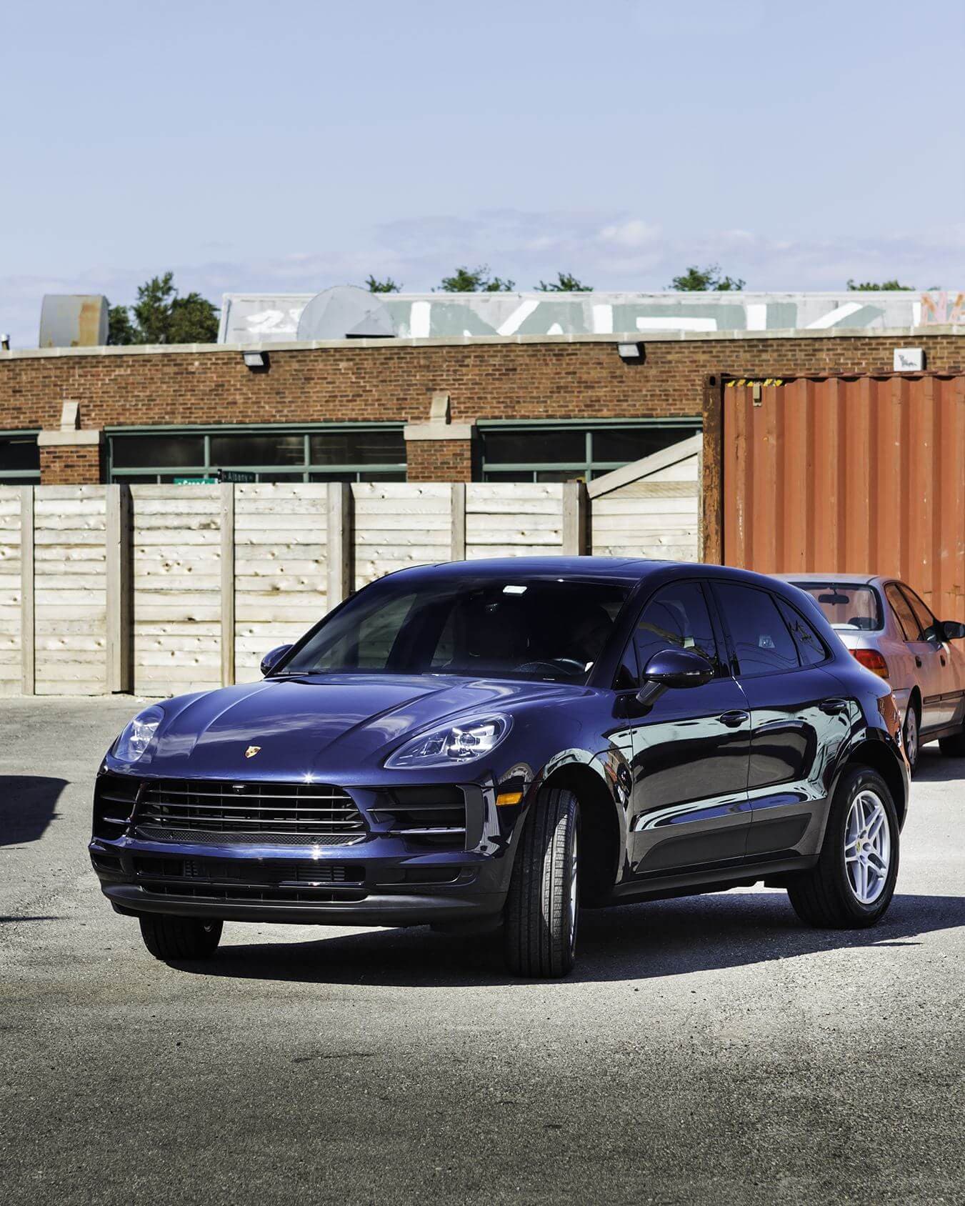 Dark blue SUV parked outside, showcasing a glossy finish after ceramic coating