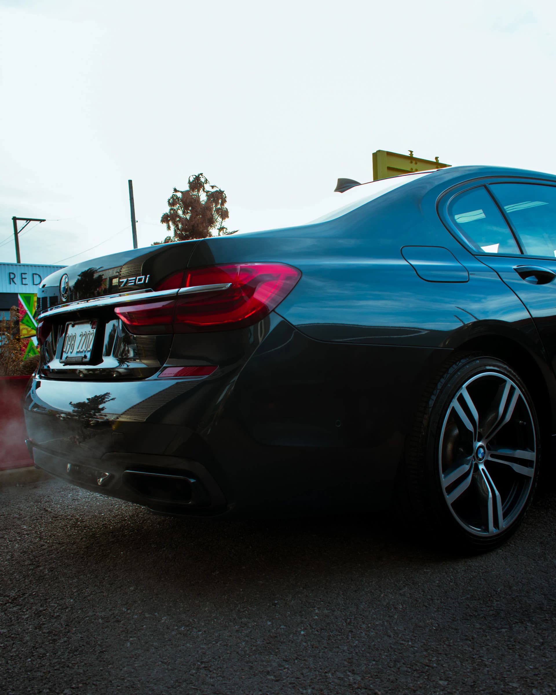 Black BMW luxury sedan parked outdoors, after Best Wash